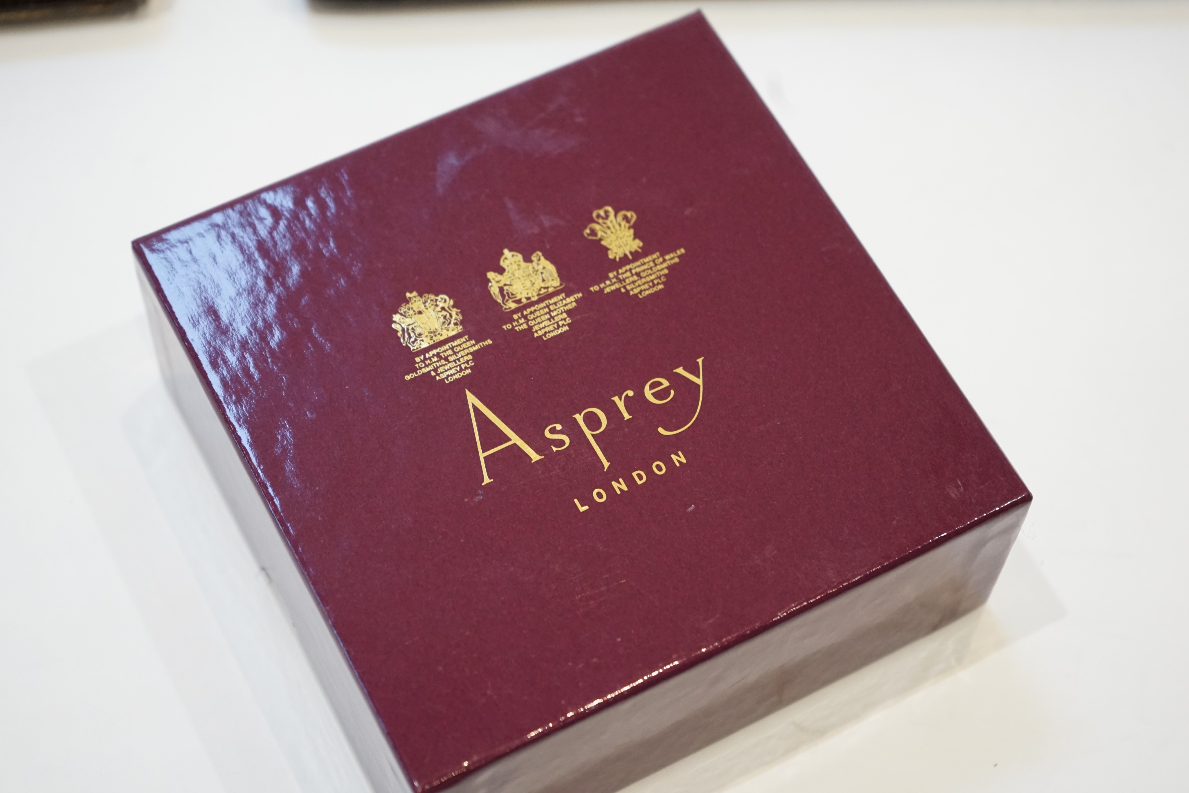 Two Asprey simulated crocodile handbags and a boxed card purse